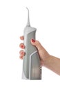 Dental irrigator in hand