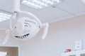 Dental light close up in dentist office. Dental clinic equipment - close up image of medical exam light. White tone Royalty Free Stock Photo