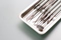 Dental medical tools in metal tray on glass table Royalty Free Stock Photo