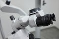 Dental microscope on the background of modern dentistry. Medical equipment. Dental operating microscope with rotary