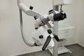 Dental microscope on the background of modern dentistry. Medical equipment. Dental operating microscope with rotary