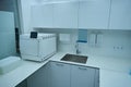 Dental office with cabinets, sink and instrument sterilization equipment