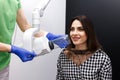 Dental patient takes an x-ray of the oral cavity