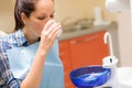 Dental patient woman wash mouth after treatment Royalty Free Stock Photo