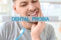 Dental phobia concept. Man suffering from toothache Royalty Free Stock Photo