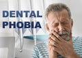 Dental phobia. Mature man suffering from toothache Royalty Free Stock Photo