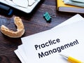 Dental practice management guidelines on desk. Royalty Free Stock Photo