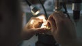 Dental prosthetic restoration. Denturist is sculpting denture from gypsus and polymer materials