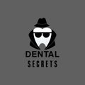 Dental secrets logo with tooth symbol for dentist stomatology
