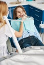 Child having fun while stomatologist taking off his tooth decay