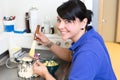 Dental technician in laboratory applying gypsum to a mold