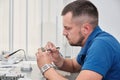 Dental technician dentist man working with dentures in his laboratory with wax Royalty Free Stock Photo