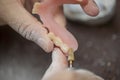 Dental technician make denture prothesis in dental laboratory Royalty Free Stock Photo
