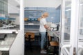 Dental technician putting porcelain prosthesis into the oven.