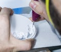 dental technician using dental burs with zirconium teeth.