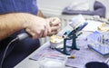 Dental technician working with articulator in dental lab Royalty Free Stock Photo