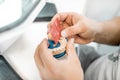 Dental technician working on gypsum jaw Royalty Free Stock Photo