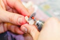 Dental technician working on a tooth crown