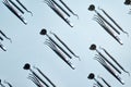 Dental tool pattern on a blue background