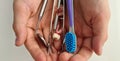 Dental tools dental implants and toothbrush in children hands. Children dentist