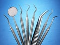 Dental tools set for teeth dental care ion blue background.