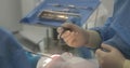 Dental treatment close-up. A dentist performs a dental procedure.