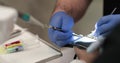 Dental treatment close-up. A dentist performs a dental procedure.