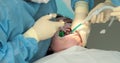 Dental treatment close-up. A dentist performs a dental procedure