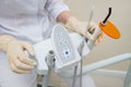 Dental UV curing light lamp . Ultraviolet polymerization Light Tool With Orange blocking glass. tooth care concept. Royalty Free Stock Photo
