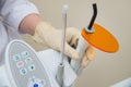 Dental UV curing light lamp . Ultraviolet polymerization Light Tool With Orange blocking glass. tooth care concept. Royalty Free Stock Photo