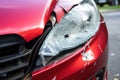 dented car bumper and shattered light after collision