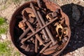 Dented Rusty Pail Full of Old Rusty Hardware Royalty Free Stock Photo