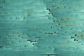 Dented texture of a scratched steel turquoise metal surface