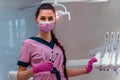 Dentis in pink uniform at the clinic Royalty Free Stock Photo