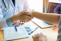 The dentist agreed with the patient by holding shaking hands with confidence