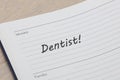 Dentist appointment diary reminder open on desk Royalty Free Stock Photo