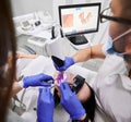 Doctor scanning patient mouth with modern intraoral scanner. Royalty Free Stock Photo