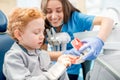 Dentist with boy at the dental office Royalty Free Stock Photo