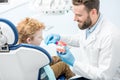 Dentist with boy at the dental office Royalty Free Stock Photo