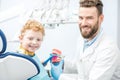 Dentist with boy at the dental office Royalty Free Stock Photo