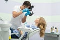 Dentist with camera and patient Royalty Free Stock Photo