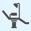 Dentist chair solid icon. Medical arm-chair with lamp. Health care vector design concept, glyph style pictogram on white