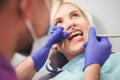 Dentist checking bracket at the braces on the female patient. Close-up. Real People. Royalty Free Stock Photo