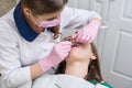 Dentist checking up patient teeth with metal braces at dental clinic office. Medicine, dentistry and health care concept Royalty Free Stock Photo