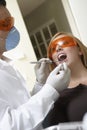 Dentist Checking Woman's Teeth