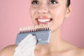 Dentist checking young woman`s teeth color Royalty Free Stock Photo