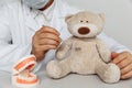 Dentist chekup teeth of teddy bear. Children dentist concept Royalty Free Stock Photo