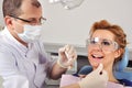 Dentist cleans teeth