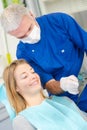 Dentist conferring with patient