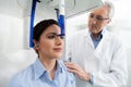 A dentist controlling his female patient before an x-ray panoramic digital Royalty Free Stock Photo